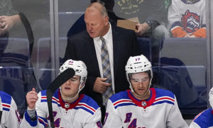 New York Rangers head coach Gerard Gallant watches the game action during the second period of an NHL preseason hockey game against the New York Islanders, Saturday, Oct. 9, 2021, in Bridgeport, Conn. (AP Photo/Mary Altaffer)
