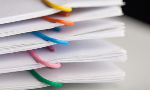 bundles of paper with paperclips