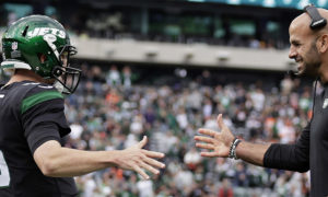 New York Jets quarterback Mike White (5) reacts with head coach Robert Saleh against the Cincinnati Bengals during an NFL football game, Sunday, Oct. 31, 2021, in East Rutherford, N.J. (AP Photo/Adam Hunger)