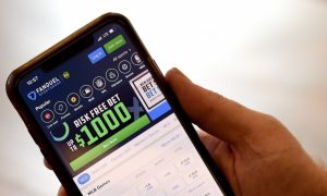 A customer navigates the FanDuel Sportsbook app, which Flutter Entertainment contends is still the top sports betting app in the country despite DraftKings saying that it is "winning."