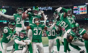 The New York Jets celebrate after a play against the Eagles, a representation of how New York sportsbooks feels after putting up huge sports betting revenue numbers in October
