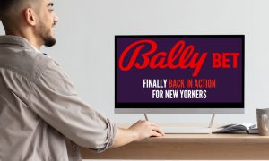 A man looks at his computer screen with a message that Bally Bet Sportsbook has returned to the New York sports betting scene.