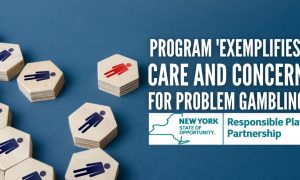 one red tile separate from group of blue tiles with new york responsible play partnership logo for story on improved voluntary self-exclusion program in NY