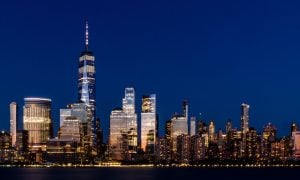 The skyline of New York City, which would presumable feature three casinos in the area. But an analyst projects that the awarding of those licenses would be delayed to 2025.