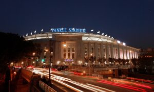 yankee stadium at night for a story on bills to allow fixed-odds horse betting on new york sportsbooks and kiosks at stadiums