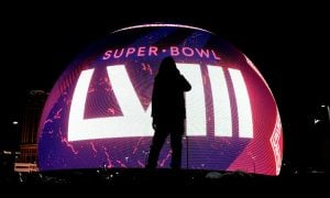 Image of a silhouette in front of the Super Bowl 58 logo for a story on GeoComply data detailing New York sports betting activity during the big game