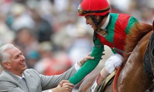 Trainer Todd Pletcher and jockey John Velazquez shake hands for a story on the two New York residents looking to once again win the Kentucky Derby