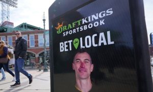 Image of a sign for DraftKings Sportsbook for a story on the New York sports betting operator facing a lawsuit alleging a security breach.
