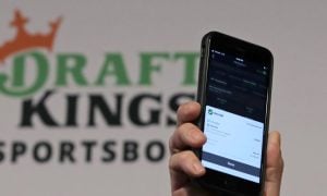 Image of a phone with DraftKings Sportsbook for a story on the New York sports betting operator adding a surcharge on winning bets.