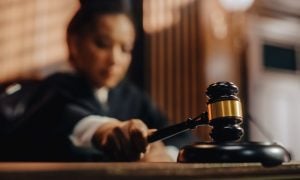 Image of a judge banging her gavel for a story on two Rochester men sentenced for operating an illegal bookmaking ring in New York.