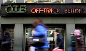 Sign for New York off-track betting for a story on lawmakers claiming buyout packages for three former executives were illegal.