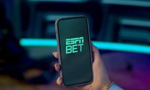 Hand holding phone with ESPN Bet Sportsbook
