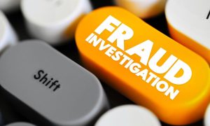 a keyboard with a fraud investigation button