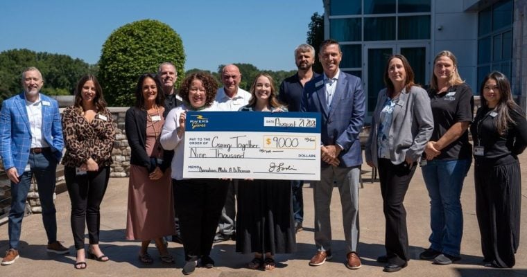 Guests' leftover chips, vouchers, and cash added up to a $9,000 check for Caring Together, a Capital Region ovarian cancer support group.